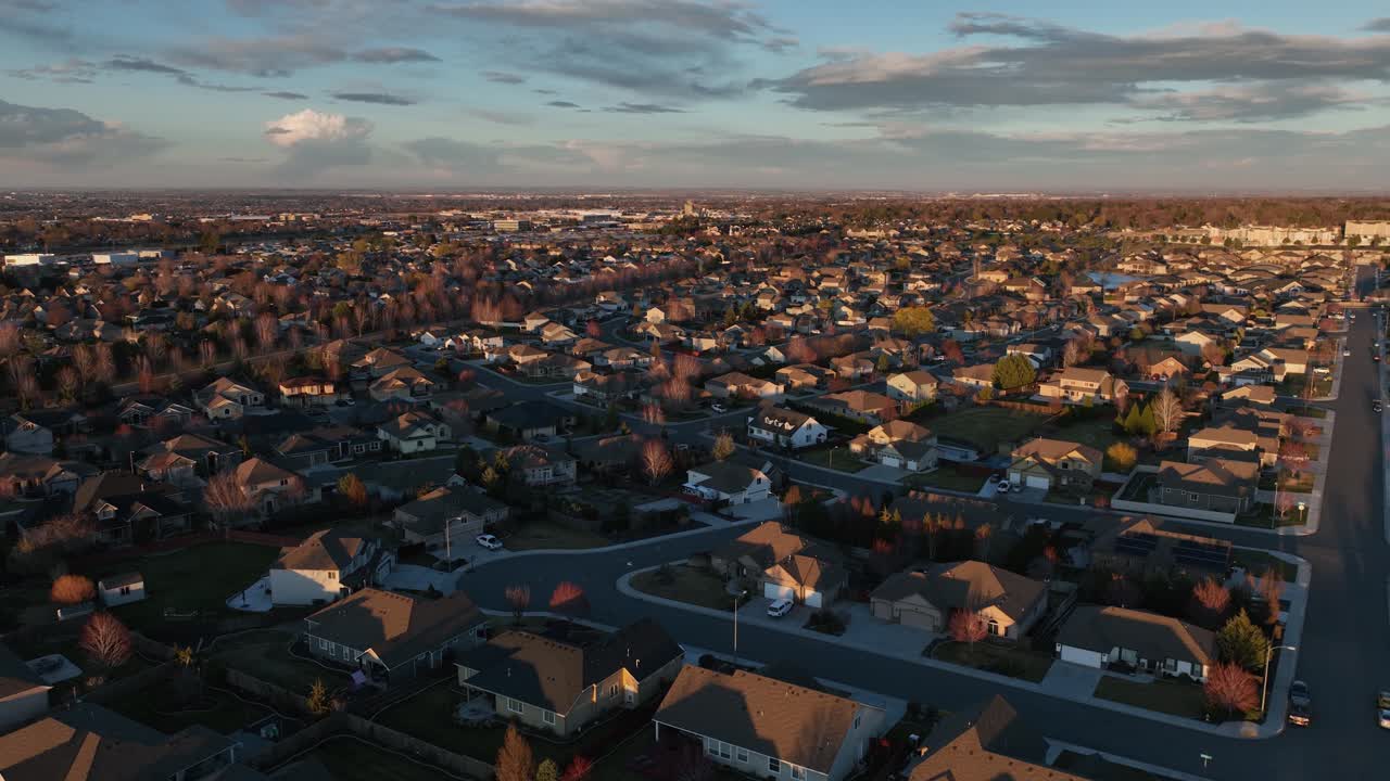Drone shot of the sun setting over a suburban neighborhood in Kennewick, Washington