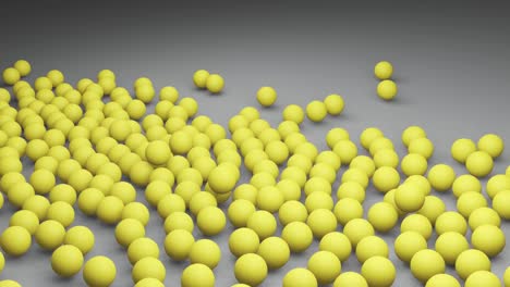 falling yellow balls or spheres on gray background. colors of the year 2021 illuminating and ultimate gray. 3d render