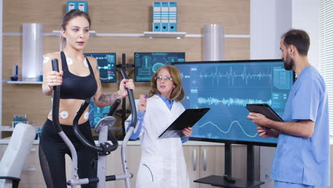 scientist in sport industry checking the cardio of female athele