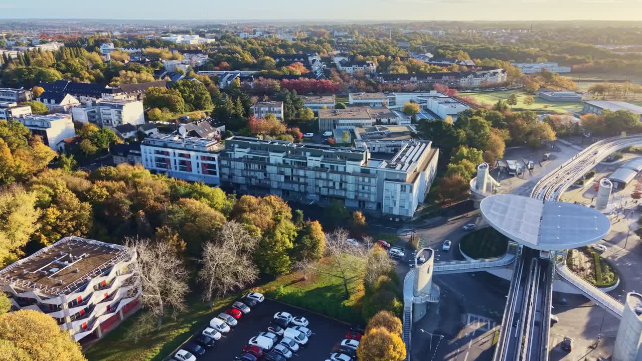 High-angle aerial view of modern structure La Poterie multimodal transit hub and elevated metro station of Rennes Metro line A, located in La Poterie Le Blosne area in the south‑east of Rennes, France