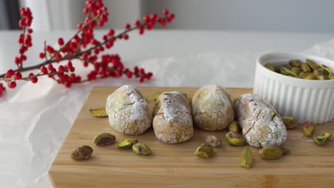 closeup slider shot of a setup for food photography, chewy pistachio amaretti christmas cookies