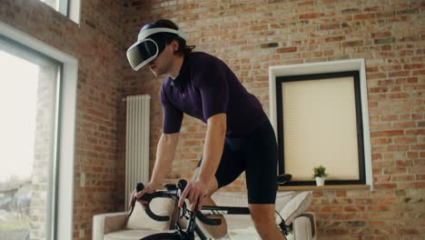 man using vr headset while cycling indoors