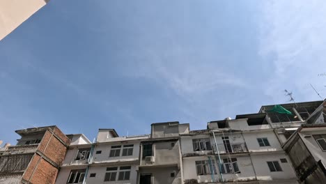 time-lapse of sky between tall buildings