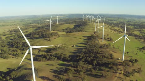 aerial view of wind power turbines spinning