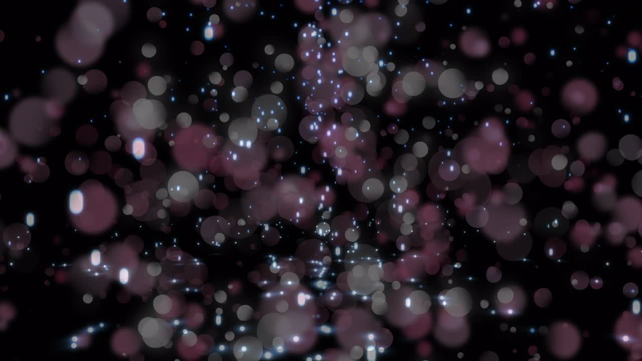 Animation of digital shiny glitters falling against illuminated lens flares