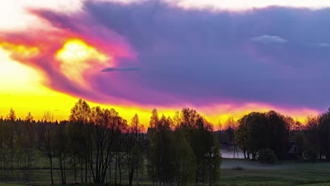 Massive-grey-clouds-flowing-over-bright-yellow-sky,-fusion-time-lapse