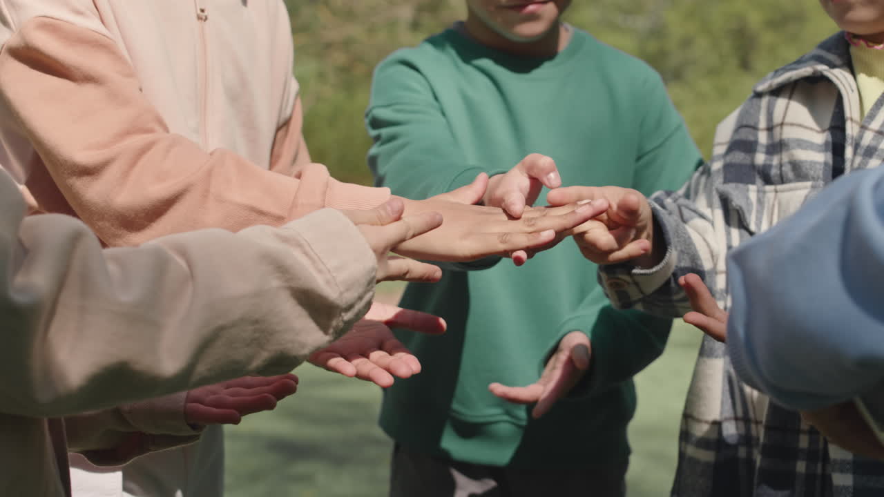 Kids Playing Rock Paper Scissors in Park