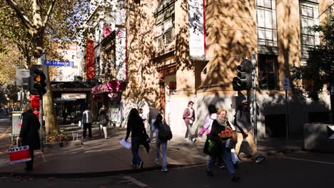 pedestrians crossing street in melbourne, march 2024