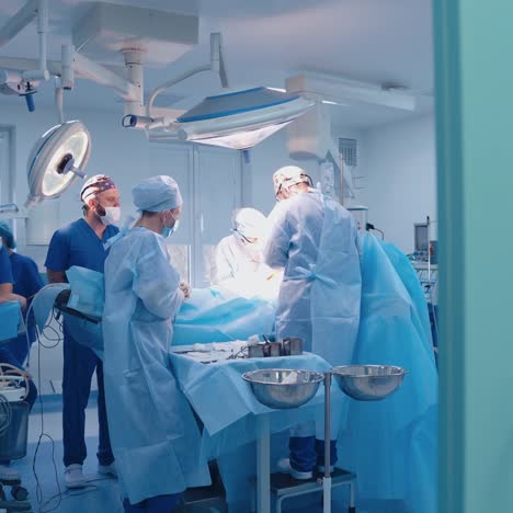 medical procedure in the hospital operating room. teamwork of surgeons performing a plastic surgery in contemporary cabinet.