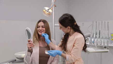 a friendly and inviting dental consultation occurs with a confident patient receiving care from a skilled dentist