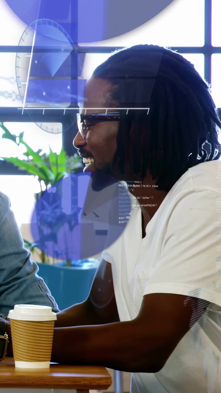 Vertical video: Camera panning showing man leaning in talking, sparking charts in business meeting