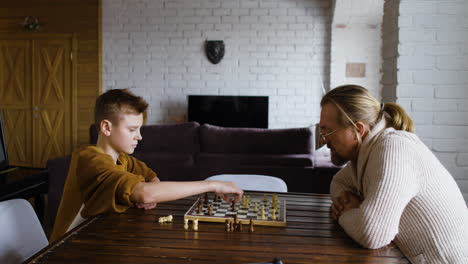 caucasian man and boy in the living room