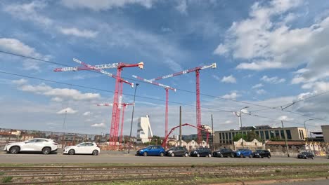 the construction of the olympic village in milan city 2026 in a beautiful sky an a lot of people working