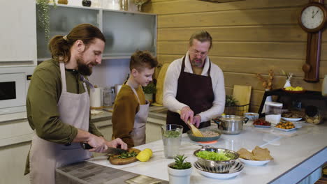 caucasian men and boy in the kitchen