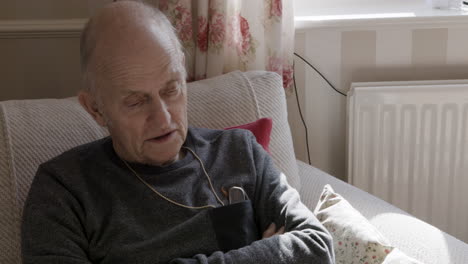 senior man relaxing indoors