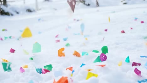 colorful confetti falling in the snow