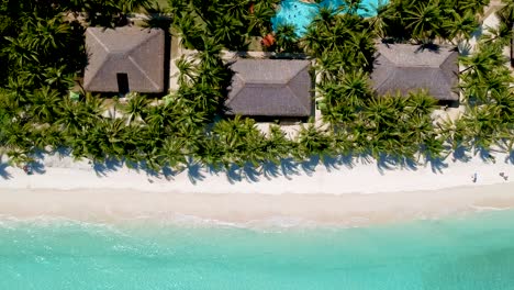 aerial-top-down-of-beautiful-beach-club-and-turquoise-sea