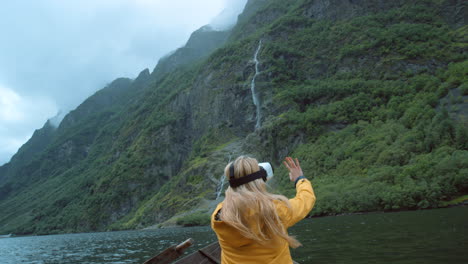 woman experiencing virtual reality in a fjord