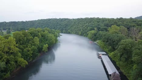 drone footage hovering over a foggy river