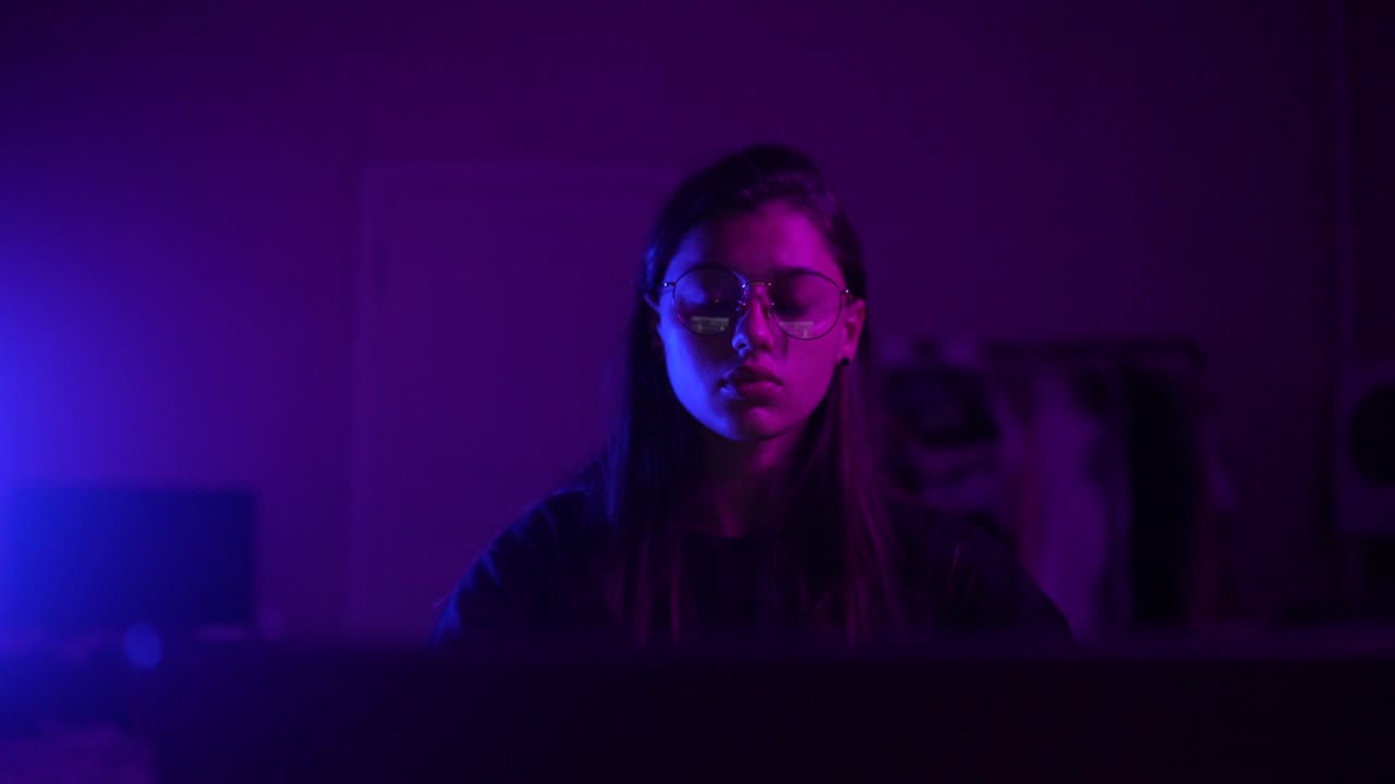 Young woman studying at night