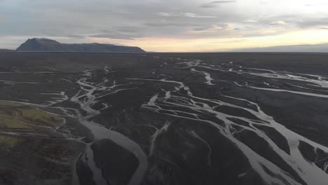 Aerial-Flyover-Glacial-Rivers-During-Sunrise