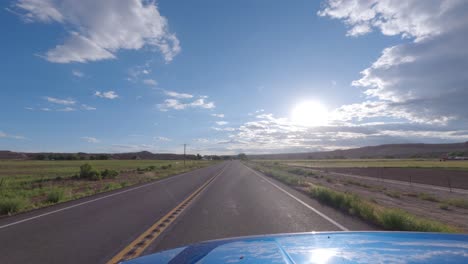 driving in a desert, rural farmland area - driver point of view