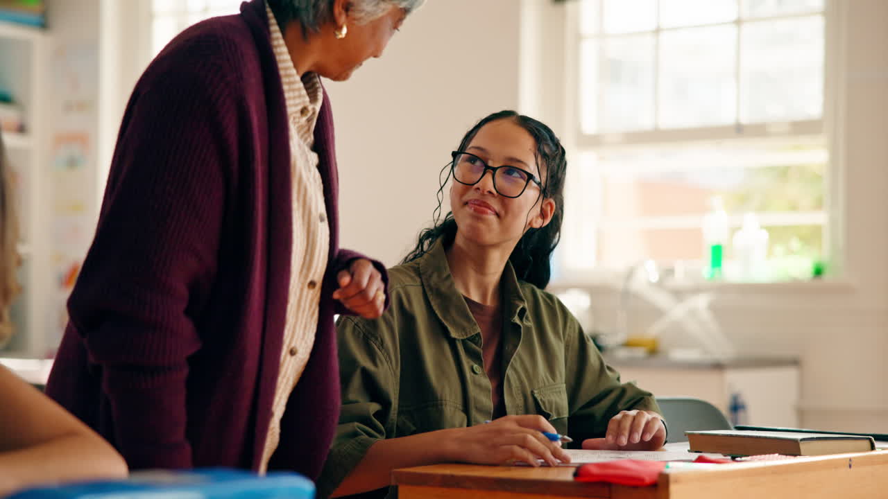 Teacher assisting student in classroom