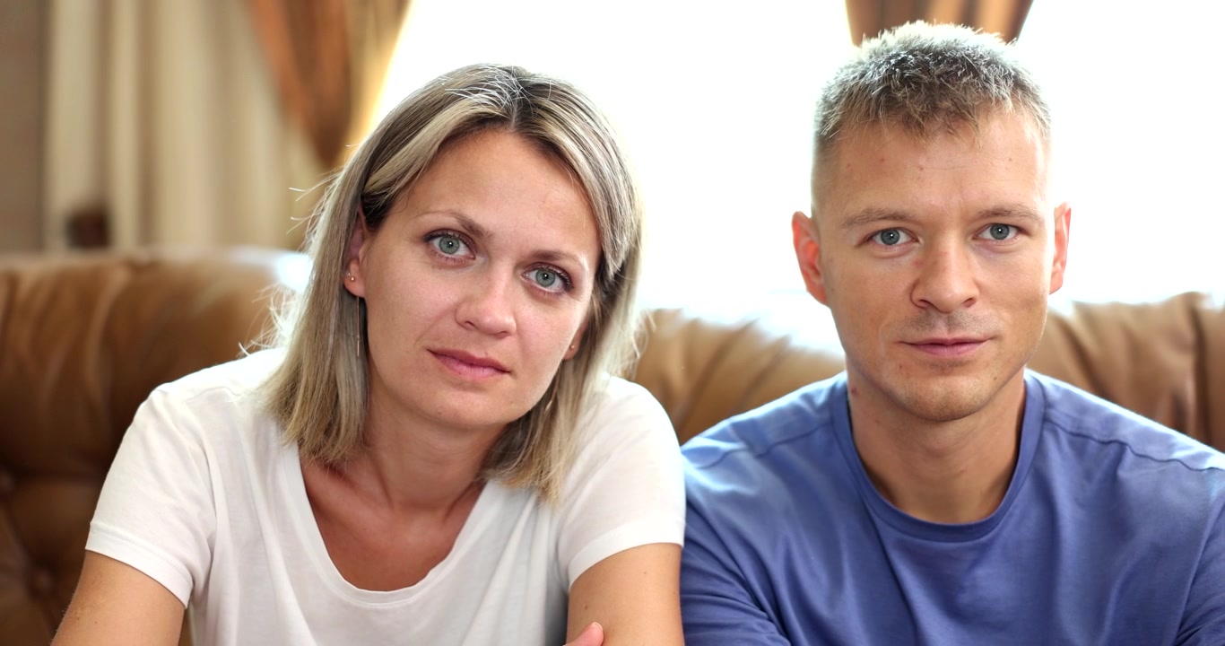 Couple shares quiet moments of connection and understanding during a cozy afternoon at home