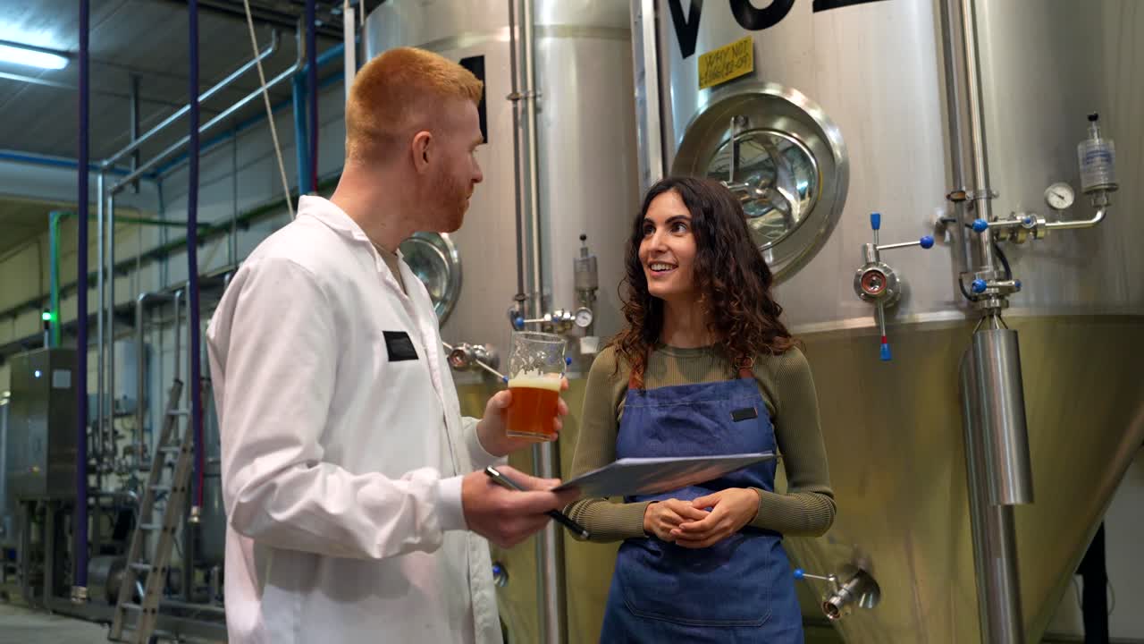 Brewery Workers Inspecting Beer Quality