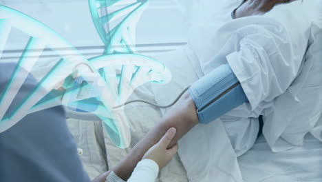 Animation-of-dna-strand-over-diverse-female-doctor-and-patient-in-hospital