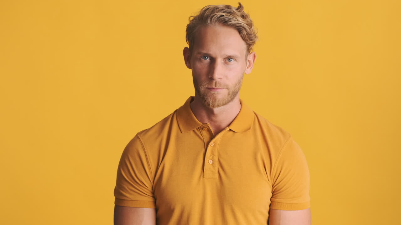 Young man nodding his head side to side and saying no