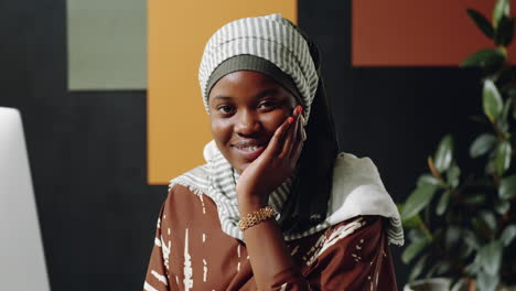 muslim black woman posing in office