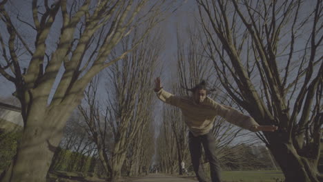 man performing yoga in park