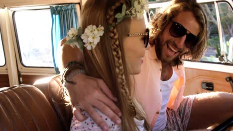 hipster couple sitting in a van