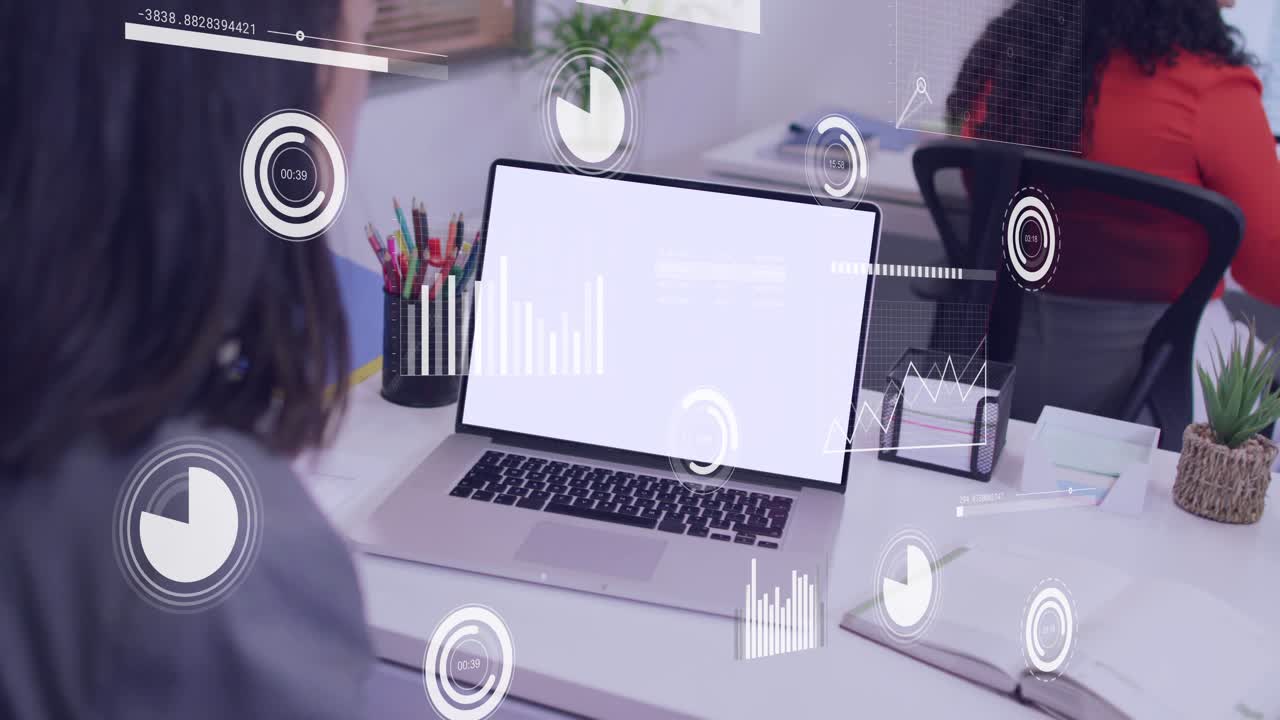 Businesswoman leaning toward laptop while blank screen causing HUD charts animating over desk