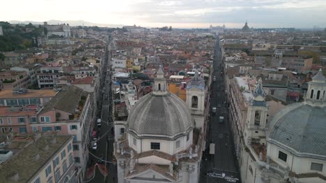 Forward-Drone-Shot-Above-Basilica-Santa-Maria-in-Montesanto,-Piazza-del-Popolo