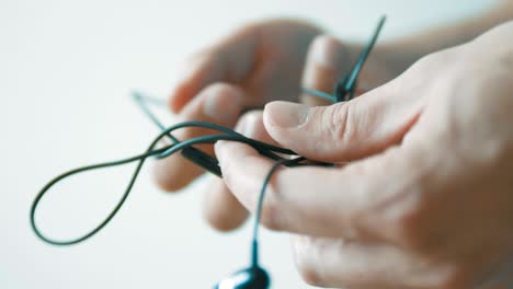 headphone wire tangled . unravel the wire and pack it correctly. a convenient way to store headphones. care for headphones