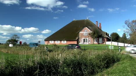 Traditional-north-German-house-with-thatched-rooves-near-town-of-Husum,-Germany-1