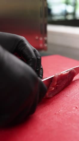 chef cutting meat
