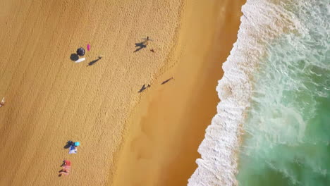 Cinematic-aerial-drone-looking-down-forward-stunning-blue-water-golden-sand-beach-coastline-morning-surfe-huge-glassy-waves-crashing-swell-surf-Hossegor-Seignosse-France-Biarritz-Basque-Country