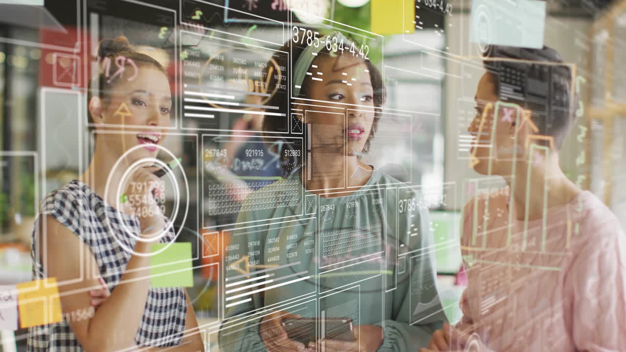 Three professionals discussing tech data on glass wall, holding phone, showing interactive charts