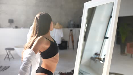 woman getting ready in a modern bathroom