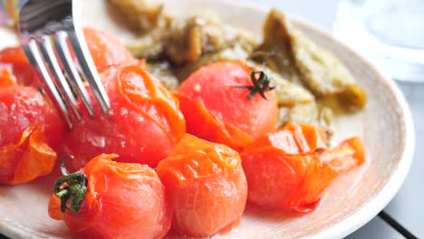 baked tomato and capsicum on plate ,