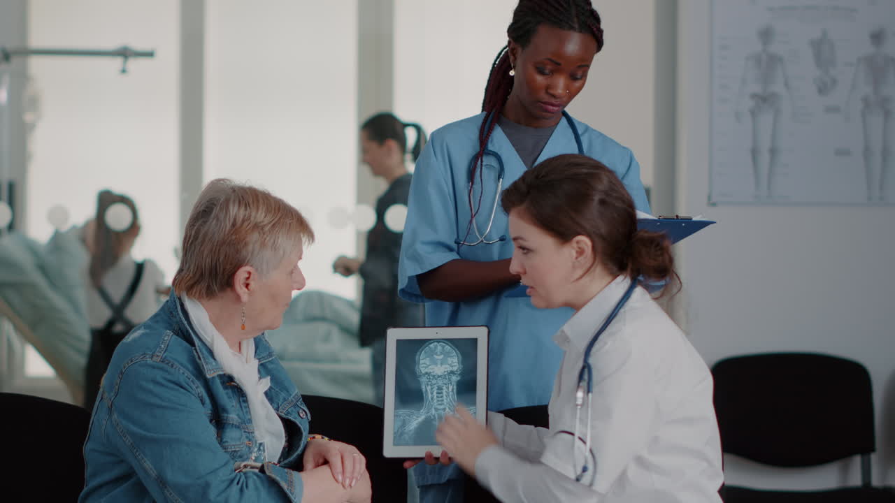 Close up of senior patient looking at radiography scan on tablet