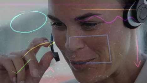 animation of colorful shapes over businesswoman wearing phone headset