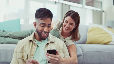 Laptop,-phone-and-couple-relax-in-a-living-room