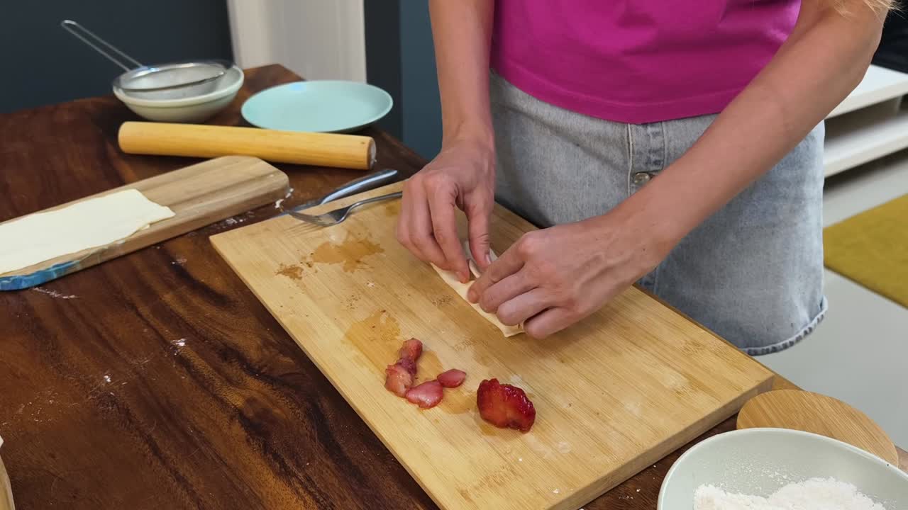 Making pastries with strawberries