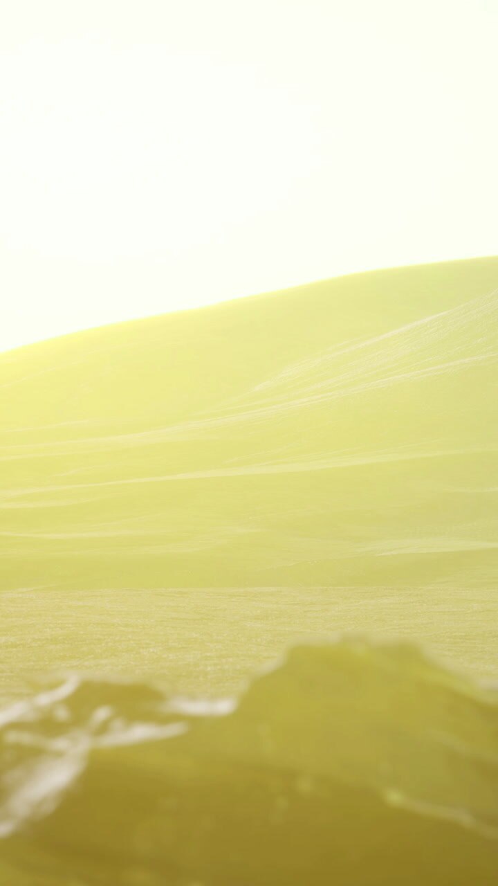 Golden sunlight spills over serene hills at dusk creating magical landscape