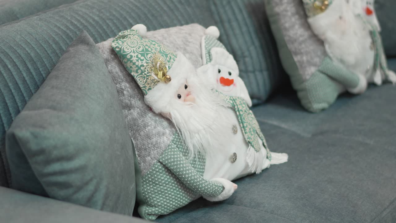 Festive Holiday Decor: Cozy Sofa with Santa and Snowman Themed Pillows. 4k.