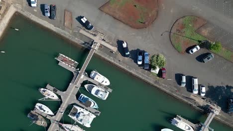 rows of sailing boats anchored in marina in oahu, hawaii - aerial top down